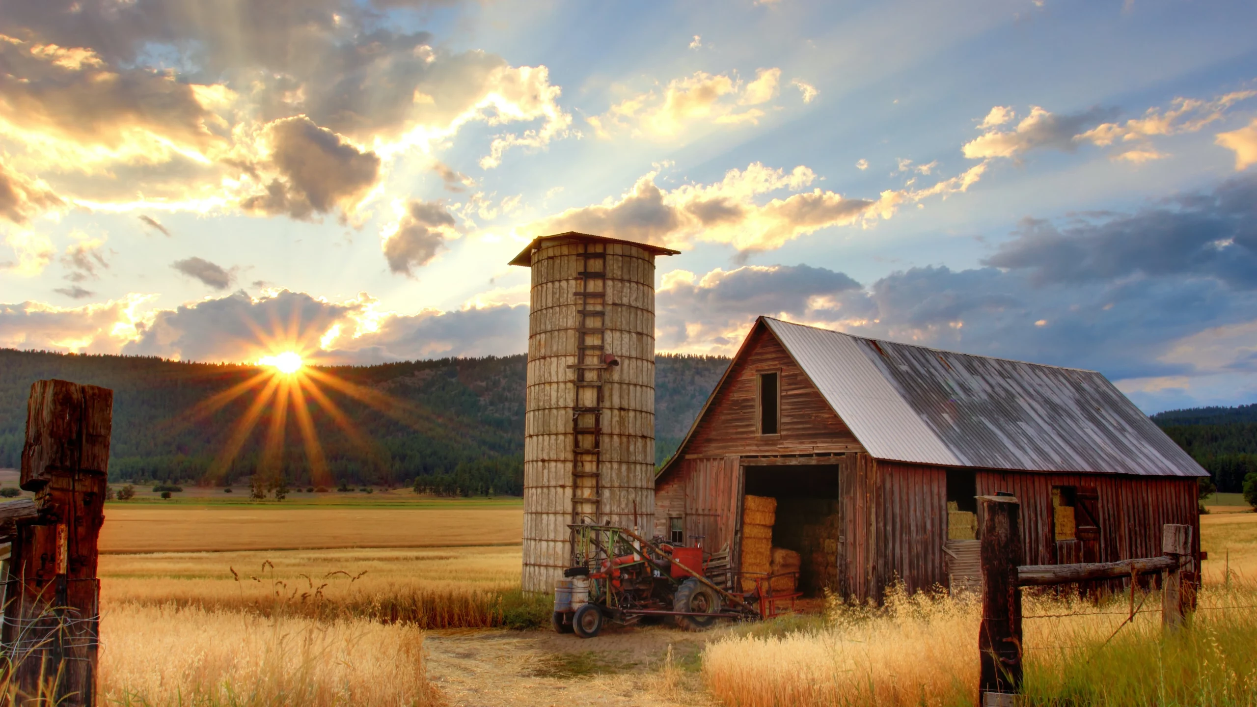 Farm sunset with an old rustic barn capturing the essence of rural life.